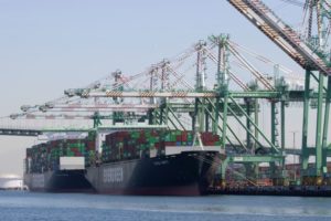 EVERGREEN SHIPS SIT AT A DOCK